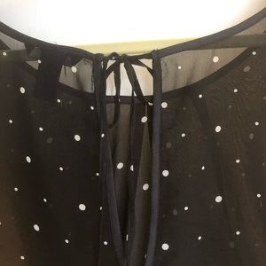 Black blouse with white polkadots